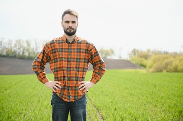 Portrait of farmer standing in field.