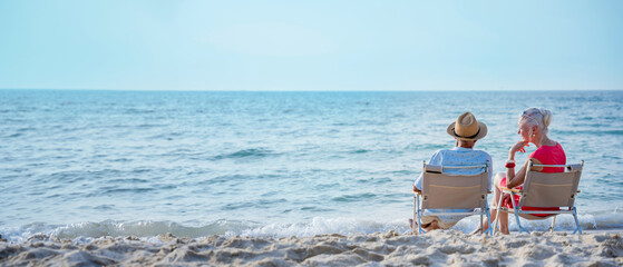Senior couple relaxing and spend time together at tropical beach., Healthy seniors lifestyle concept.