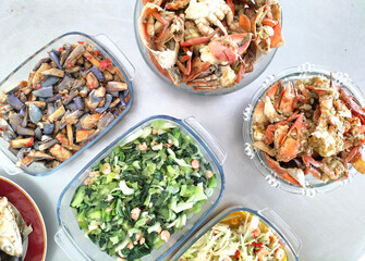 Variety of delicious  Indonesia daily home cooked food on table. Flat lay top down table view.
