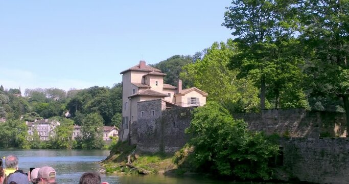 Chapel and Saint Anne priory at the tip of Ile Barbe on Saone river, seen from tour boat, Lyon, France