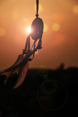 Dreamcatcher sunset , with white feather thread and beaded string. Handmade Dreamcatcher.The light...
