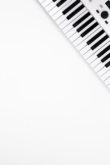 Synthesizer on a white background, midi keyboard isolated, minimalism, copy space.