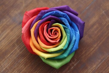 Heart-shaped rose featuring the colors of the LGBTQ. Generative AI.