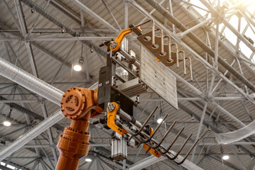 Automated robotic technological manipulator loader at the factory