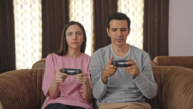 Indian couple playing video games