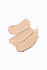 Liquid foundation smudge on white background. Beauty skincare texture swipe swatch. Cosmetic makeup...