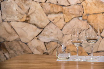 two glasses and a glass for wine tasting in a winery