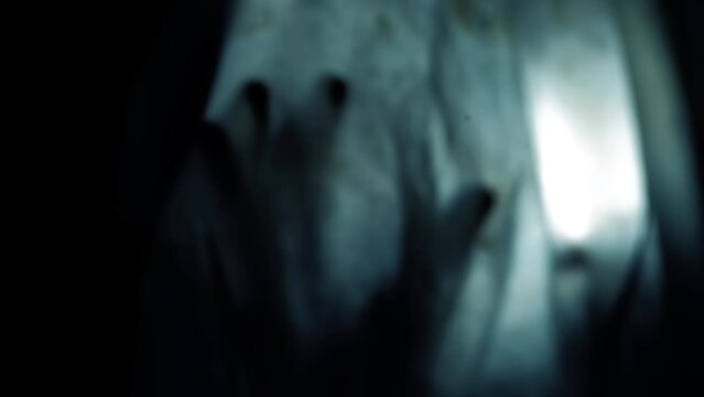 Shot of a man with a ghost costume on, a mysterious man in a ghost costume.Creative dark lights. HD footage. Easy to use.