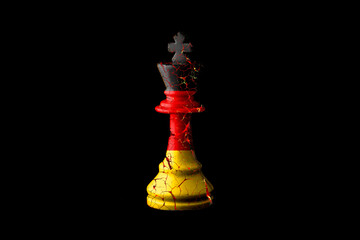 Germany flags paint over on cracked chess king. 3D illustration. Economic crisis OR recession in Germany concept.