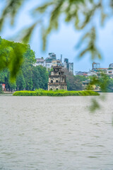 Hoan Kiem Lake ( Ho Guom) or Sword lake in the center of Hanoi in the morning. Hoan Kiem Lake is a famous tourist place in Hanoi. Travel and landscape concept.