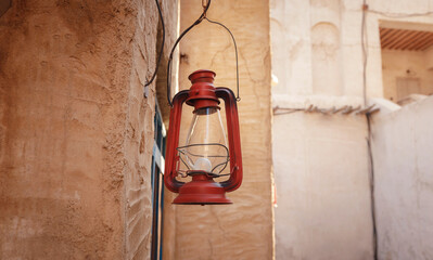 Al seef old historical district with traditional Arabic architecture. Vintage Lamp hanging outside the Al Seef Heritage Hotel, Dubai.