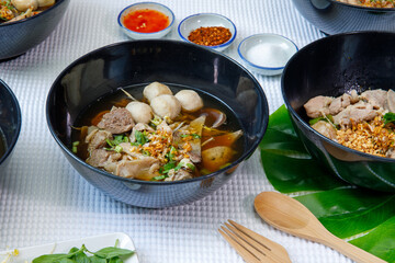 Braised pork and pork ball with noodles soup in bowl, Chinese-Thai food.