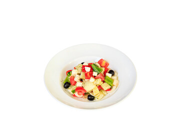 Greek salad in stylish white bowl, goat's cheese