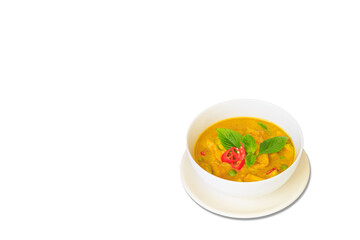 Thai food green curry isolated on white background ,sliced chicken beast fillets, quartered eggplants, pea eggplant, basil leaves and pepper.