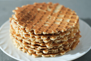 close up view of a pile of dutch waffels. traditional Holland dessert, home bakery, round crispy waffers