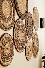 Rattan wicker wall decor bohemian style. Eco friendly trendy room decoration. side view.