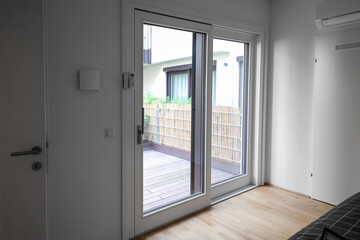 Fototapeta premium Big glass door in light room