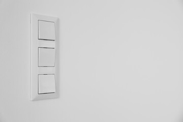 Modern switches on white wall