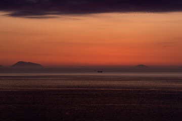 Sunset from the purple coast of Calabria, in the background the Aeolian Islands.
