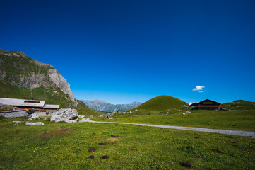 Fototapeta premium Bern, Switzerland - July 25, 2022 - View of Engstligenalp from the Engstligengrat hiking trail, Swiss Alps, Switzerland