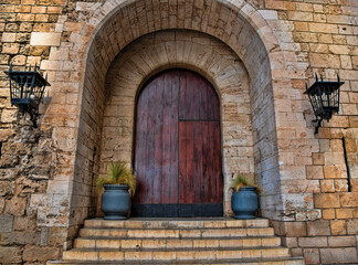 Exterior of Large Old Wooden Arched Door in Spain