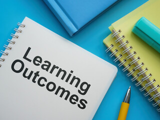Notebooks, pen and document about Learning outcomes.