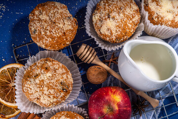 Apple pie crumble streusel muffins, Sweet autumn baking pastry with red apple slices, cinnamon and...