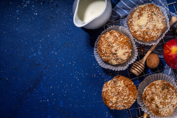 Apple pie crumble streusel muffins, Sweet autumn baking pastry with red apple slices, cinnamon and...