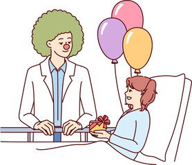 Clown doctor gives gift to child who is in hospital and needs support and positive emotions