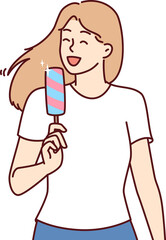 Woman eats ice cream to cool off in hot summer weather and enjoy cold sweet dessert