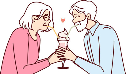 Elderly romantic couple drinking cocktail from straws together enjoying retirement and dating