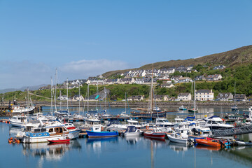Fototapeta na wymiar 25 May 2023. Mallaig,Scotland. This is the Mallaig Harbour and Marina on the West Coast of Scotland on a very sunny afternoon.