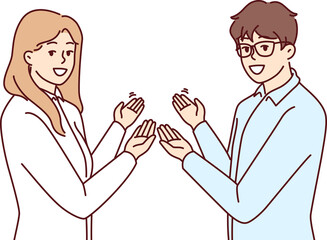 Fototapeta premium Couple man and woman in business clothes make inviting gesture with hands urging you to visit sale