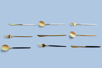 Golden cutlery on blue background