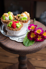 Sweet dessert on display in vintage style on a wooden stand. Rustic pastry shop style