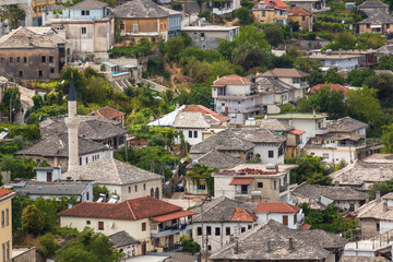 Fototapeta na wymiar Cityscape of Gjirokaster old town, Albania. Christian church and old ottoman houses in Gjirokaster, Albania close-up