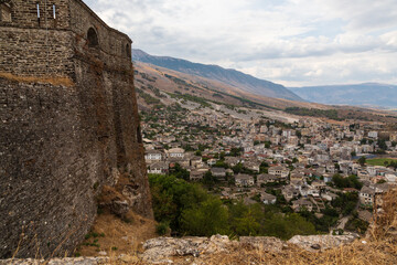 Fototapeta na wymiar Fortress at Gjirokaster, a beautiful town in Albania where the Ottoman legacy is clearly visible. High above the town the huge castle offers panoramic views