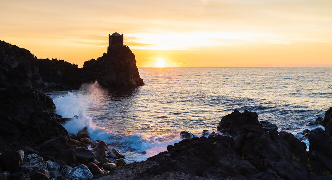 Torre Saracena dawn old tower, Santa Tecla, Sicily. Sea and sunrise