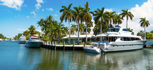 Fototapeta premium seaside harbor destination. view of harbor with yachts at seaside summer destination. picturesque seaside summer destination with docked boats in harbor. Seaside harbor perfect destination for summer