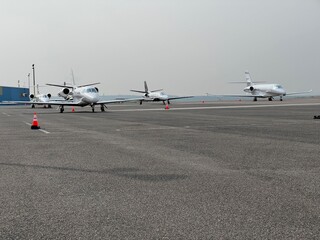 small airplanes and jets on the private airport airfield