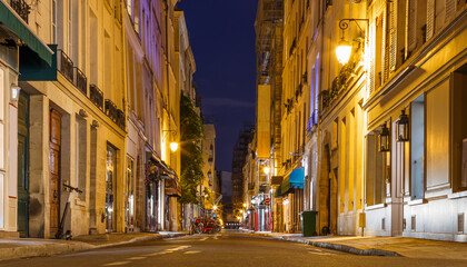 Fototapeta na wymiar Night street view in Paris, France, Europe. Old architecture