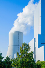 Cooling Tower and modern thermal power station. Power and fuel generation concept. Vertical image.