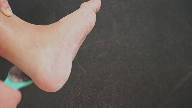 A metallic foot file for pedicure. One side is rough. It is designed to remove dead skin and calluses from the feet, leaving them smooth and soft. A great addition to anyone's self-care routine.