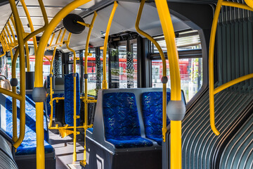 Interior design of a modern bus. Empty bus interior. Public transport in the city. Passenger...