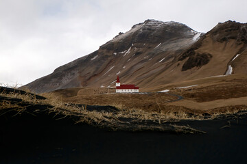 Small Islandic Church with vast background in Vik