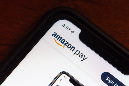 Vancouver, CANADA - May 23 2023 : Amazon Pay logo seen in its website on an iPhone screen. Amazon Pay is an Amazon-owned online payments service for various related shopping websites.