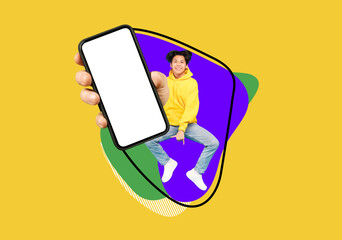 Fototapeta Cheerful Asian Teen Guy Jumping Up With Big Blank Smartphone In Hand obraz