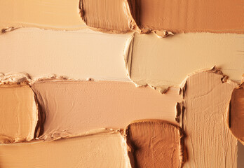 Cosmetic concealer or foundation smudge assortment set palette background