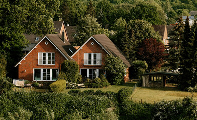 Germany, Europe - 05 25 2023: Two tiny and tidy private houses in the countryside in Germany.