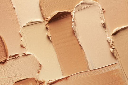 Cosmetic concealer or foundation smudge assortment set palette background